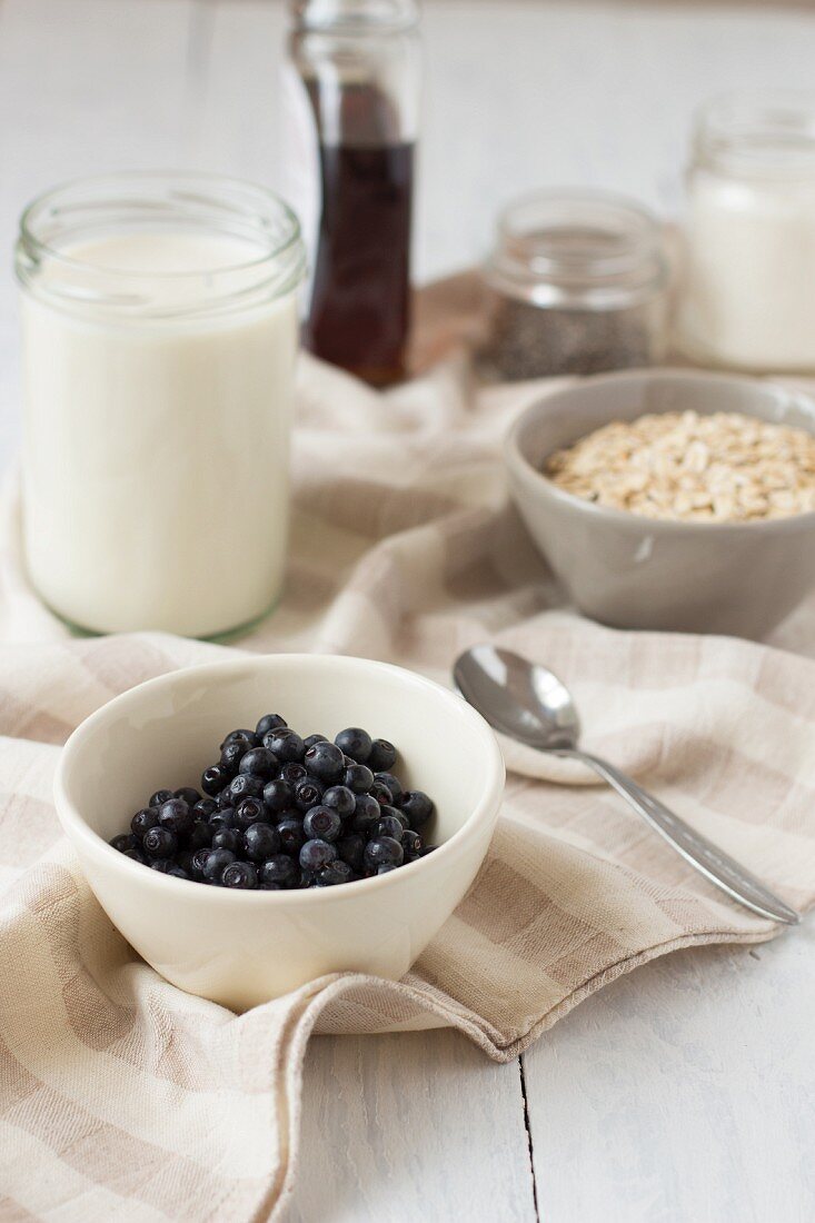 Ingredients of pudding with oats and blueberries