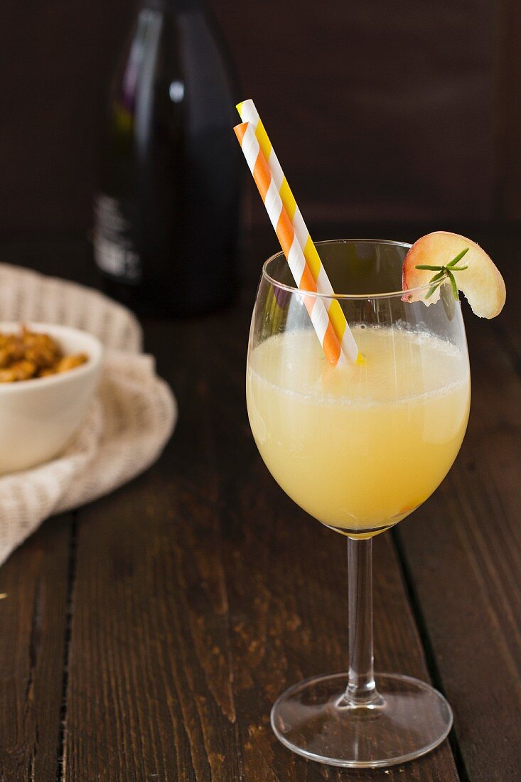 A Bellini cocktail with peach