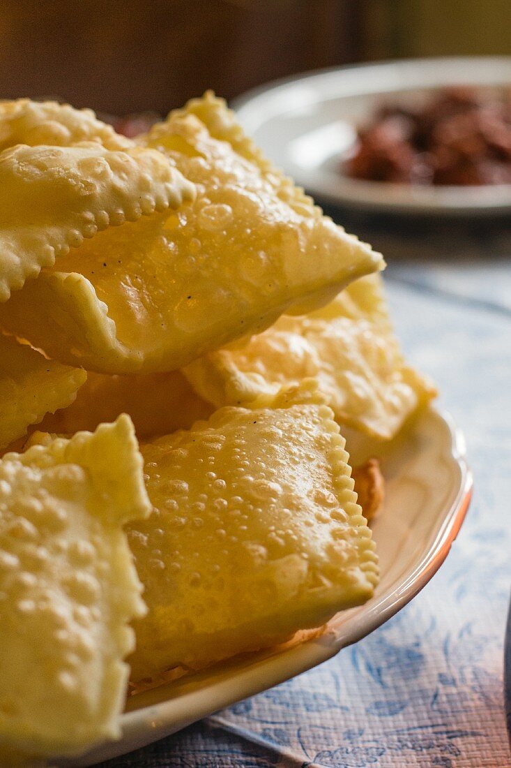 Deep-fried pastries on a plate (close)