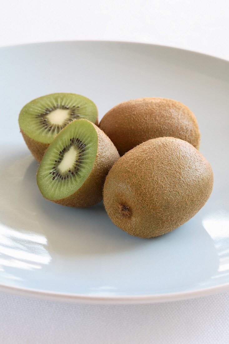 Kiwi fruit, whole and halved