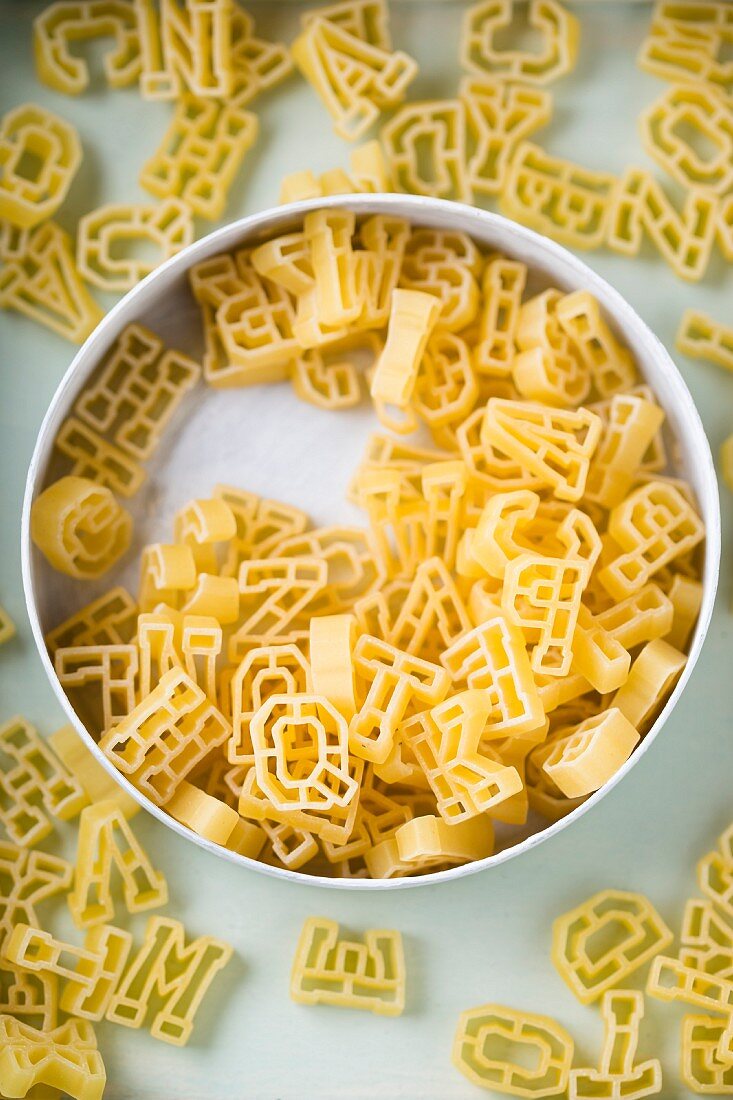 Alphabet pasta in a tin (seen from above)