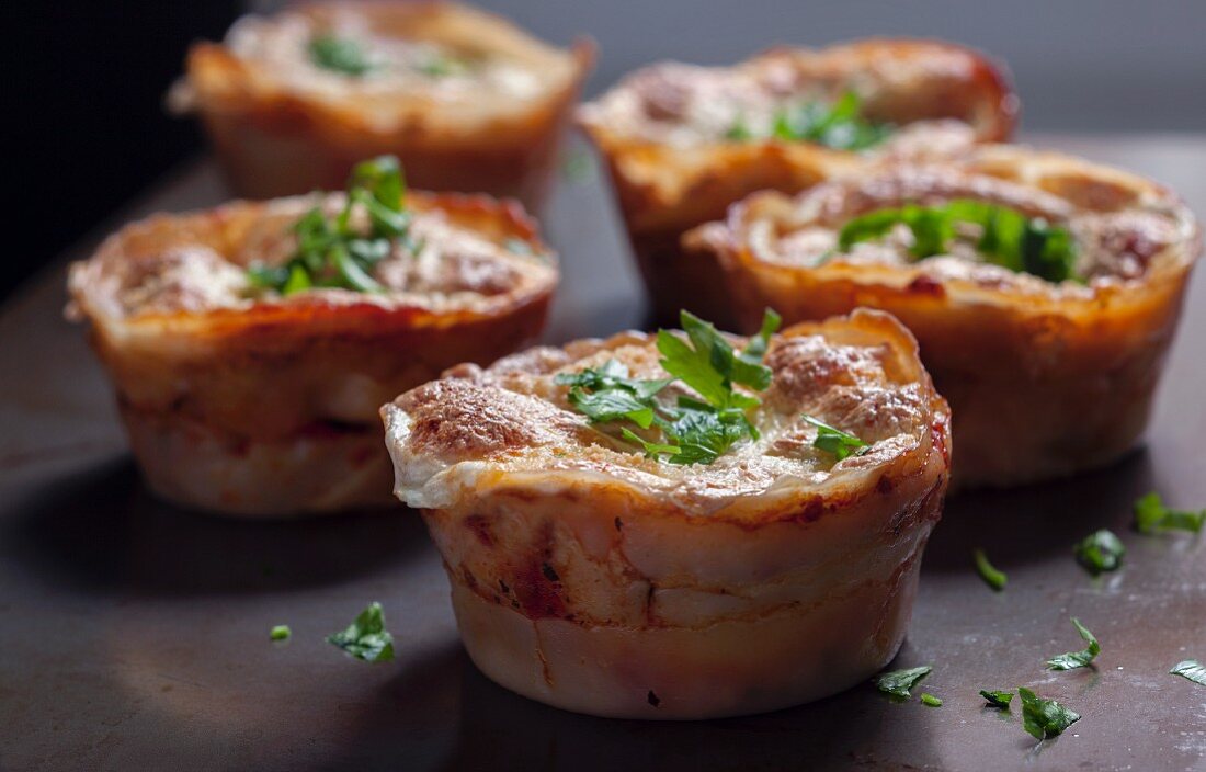 Mini lasagnes baked in wonton sheets