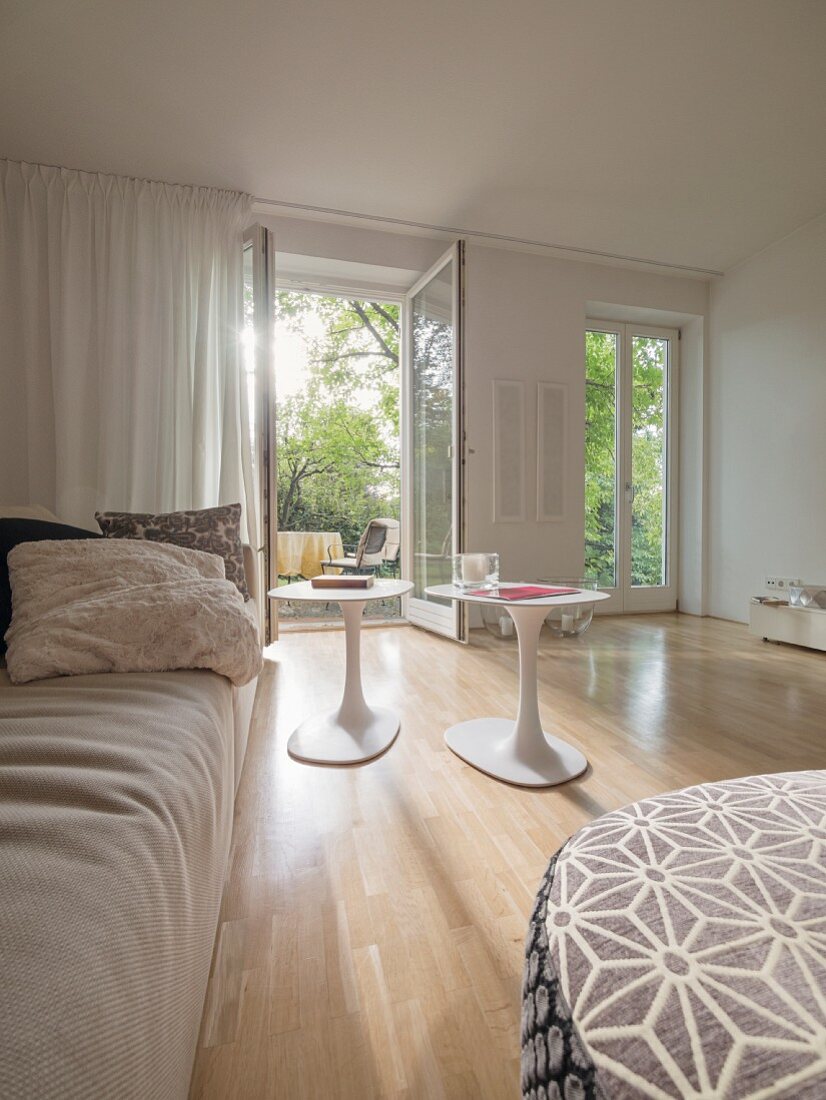 Modern living room with view through open terrace door