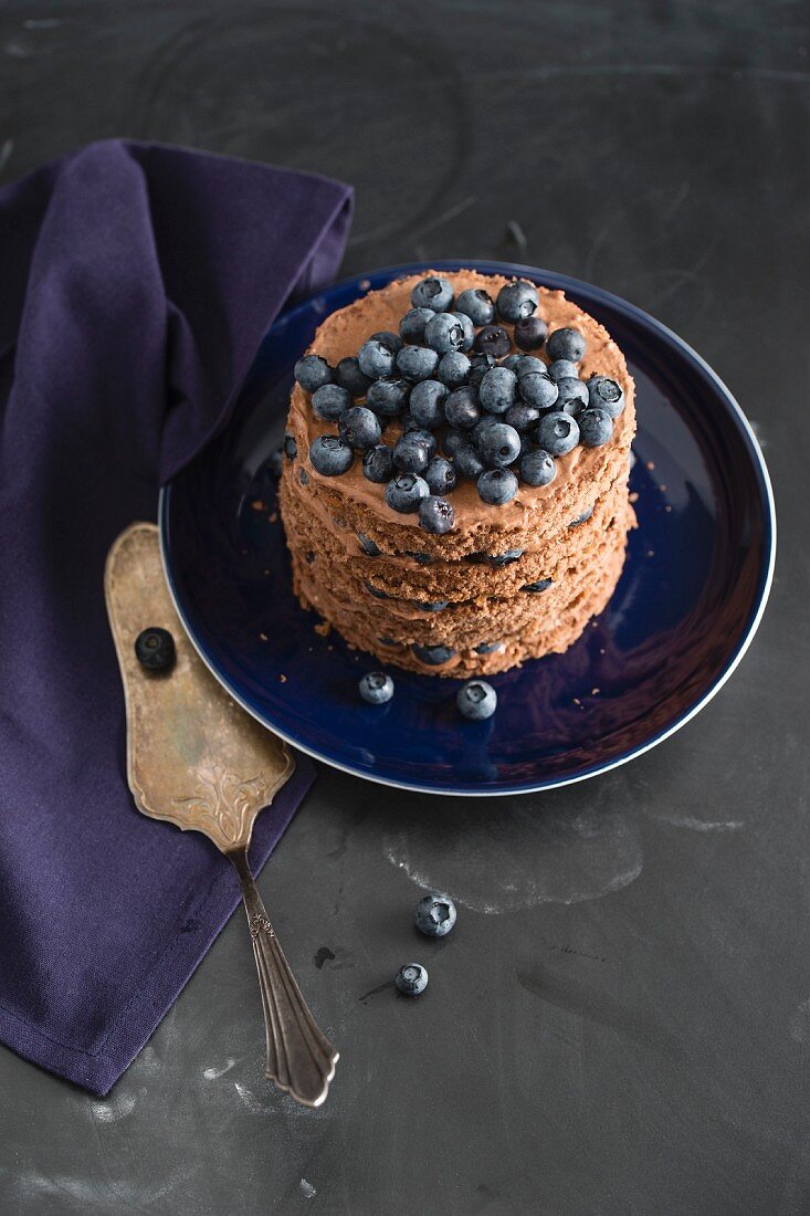 A mini chocolate cake with blueberries