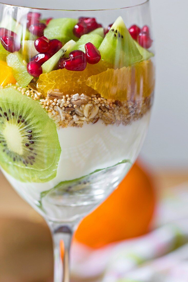 Yogurt with fresh fruit and muesli in a glass