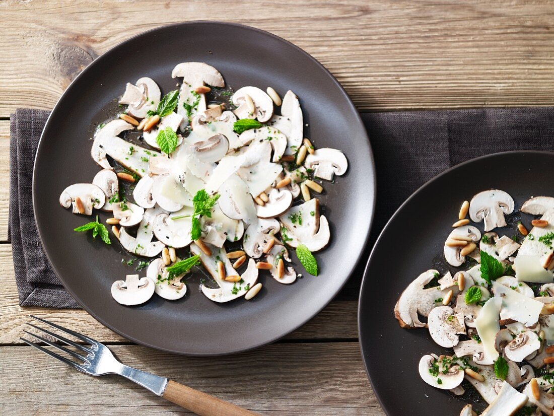 Mushroom carpaccio with pine nuts and Parmesan cheese