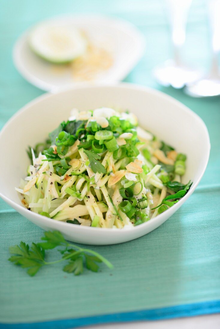 Raw kohlrabi with spring onions and parsley