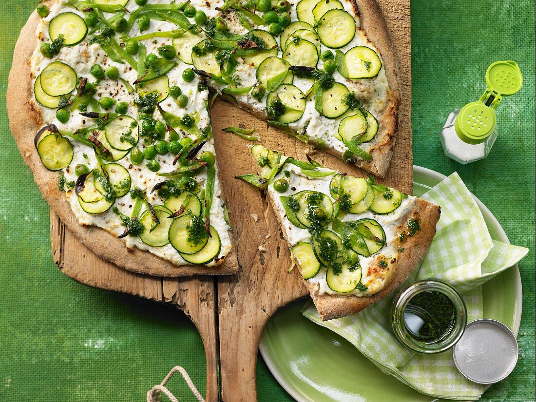 A vegetarian pizza with parsley oil