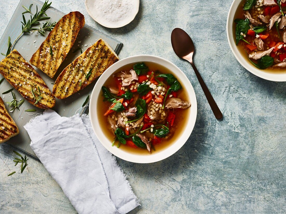 Lamb soup with barley, rosemary and bruschetta