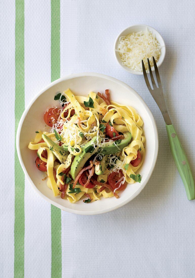 Pasta with bacon, avocado and cherry tomatoes