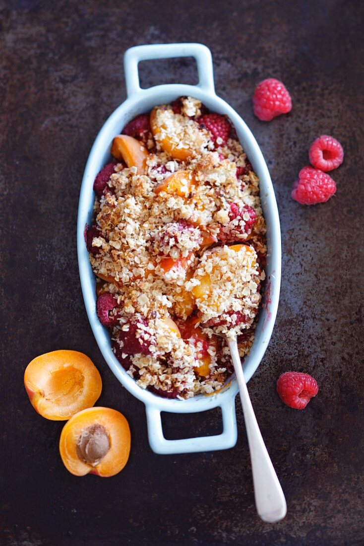 Apricot and raspberry crumble in a baking dish