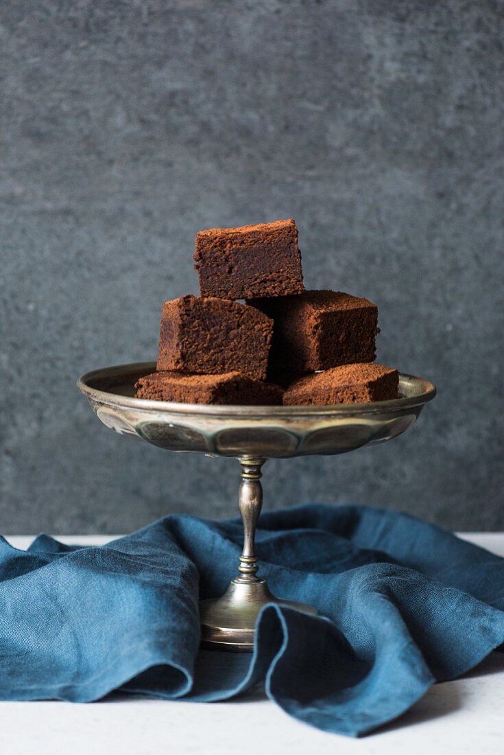 Miso chocolate brownies on a cake stand