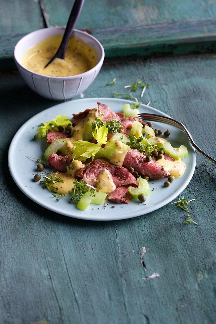 Fine meat salad with roast beef, celery, capers and a mustard dressing