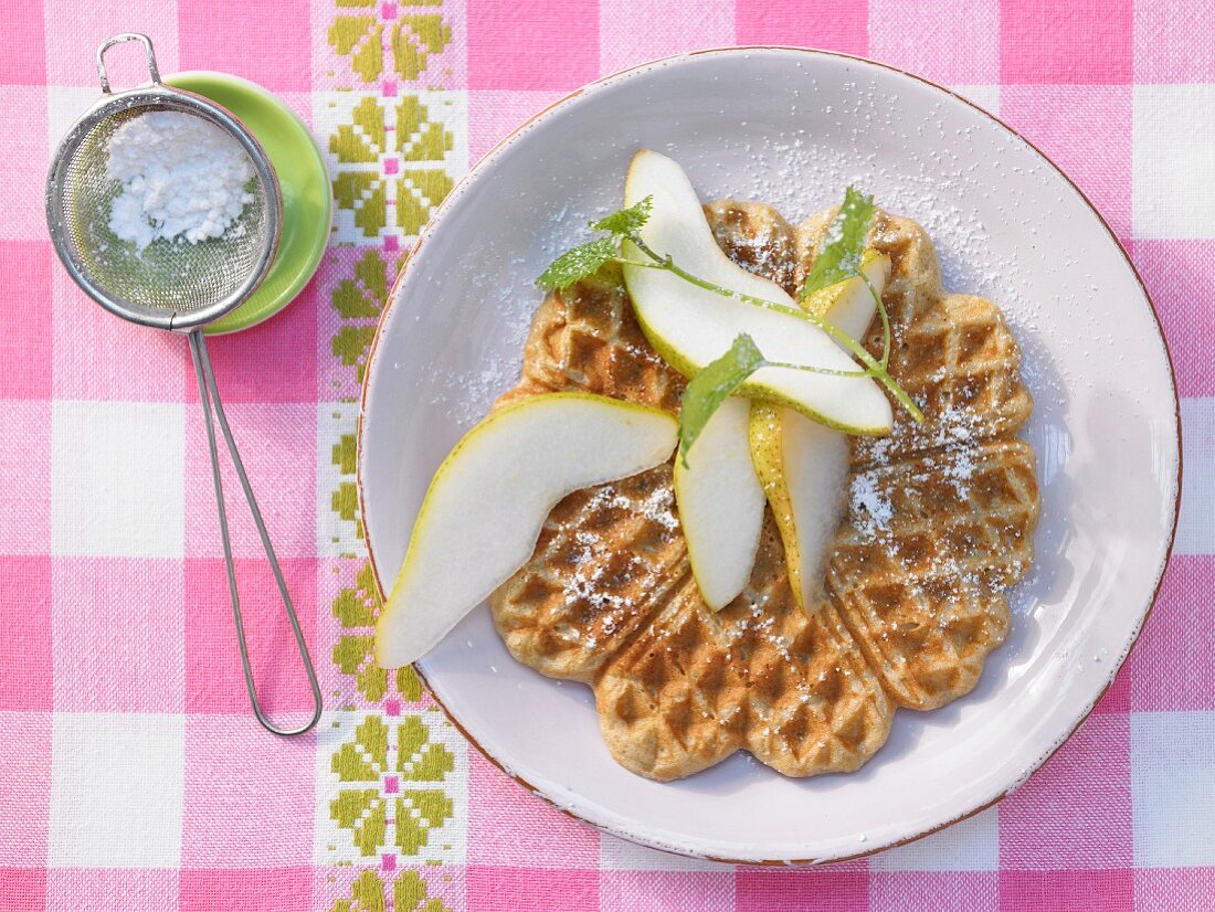 Chestnut waffles with pear wedges
