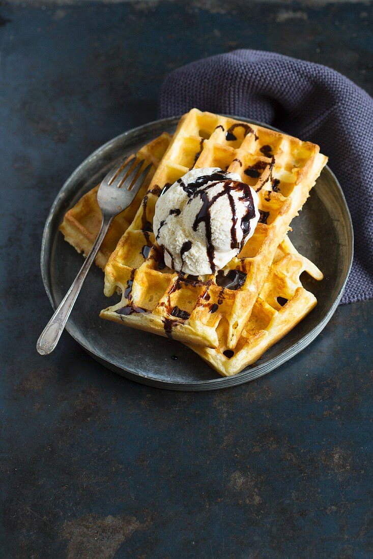 Belgian waffles with vanilla ice cream and chocolate sauce