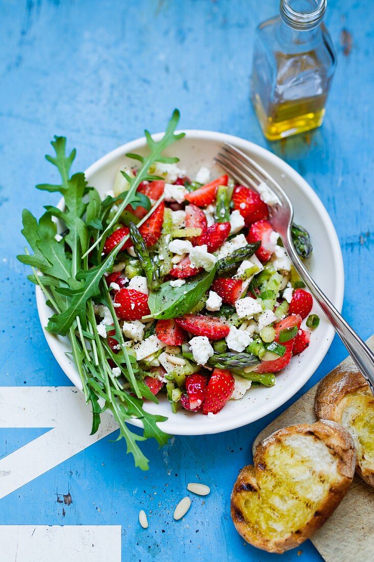 Strawberry and asparagus salad with feta cheese and pine nuts