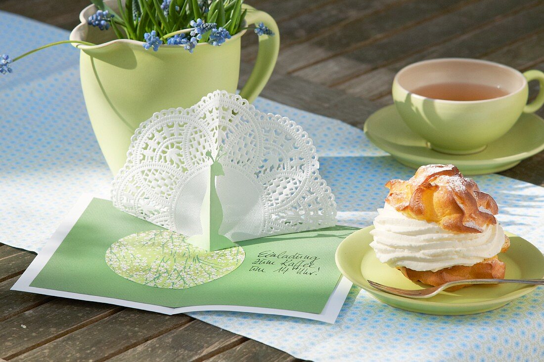Spring-green place setting with green tea set and invitation card