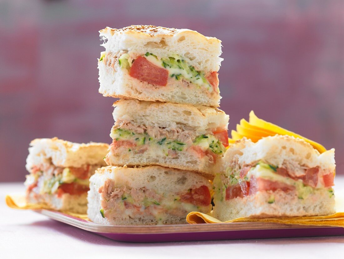 Stuffed unleavened bread with tuna fish, tomatoes and courgettes