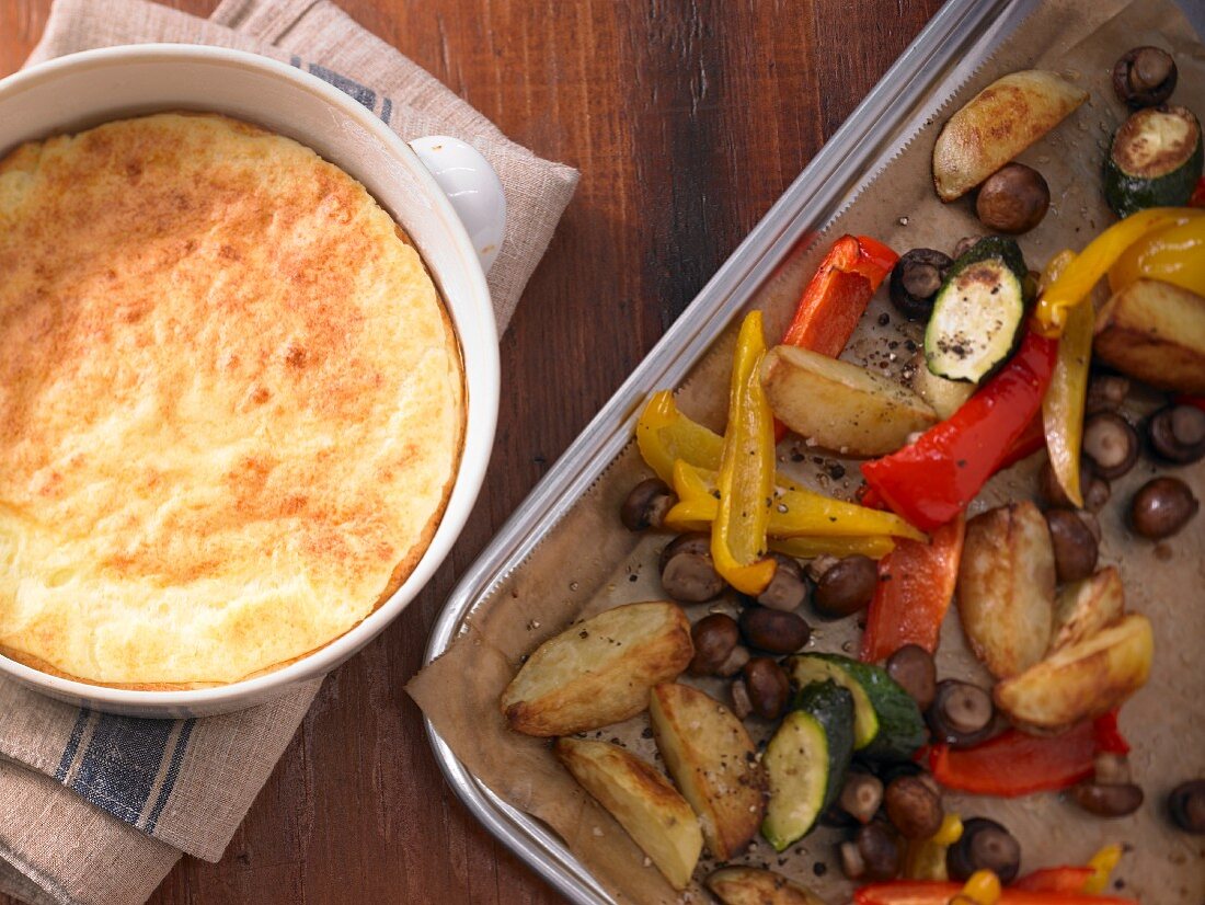 Cheese soufflé with colourful oven-roasted vegetables