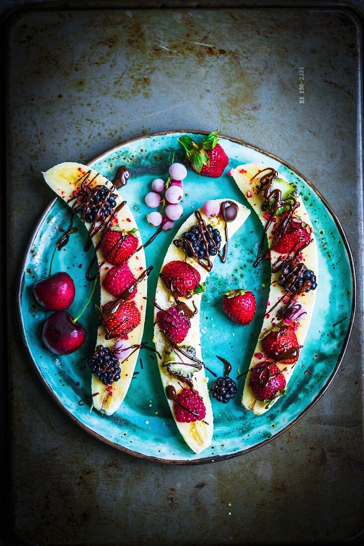 Bananas with berries and chocolate