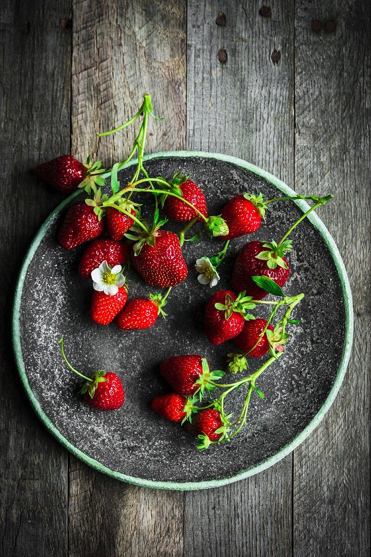 A plate of fresh strawberries
