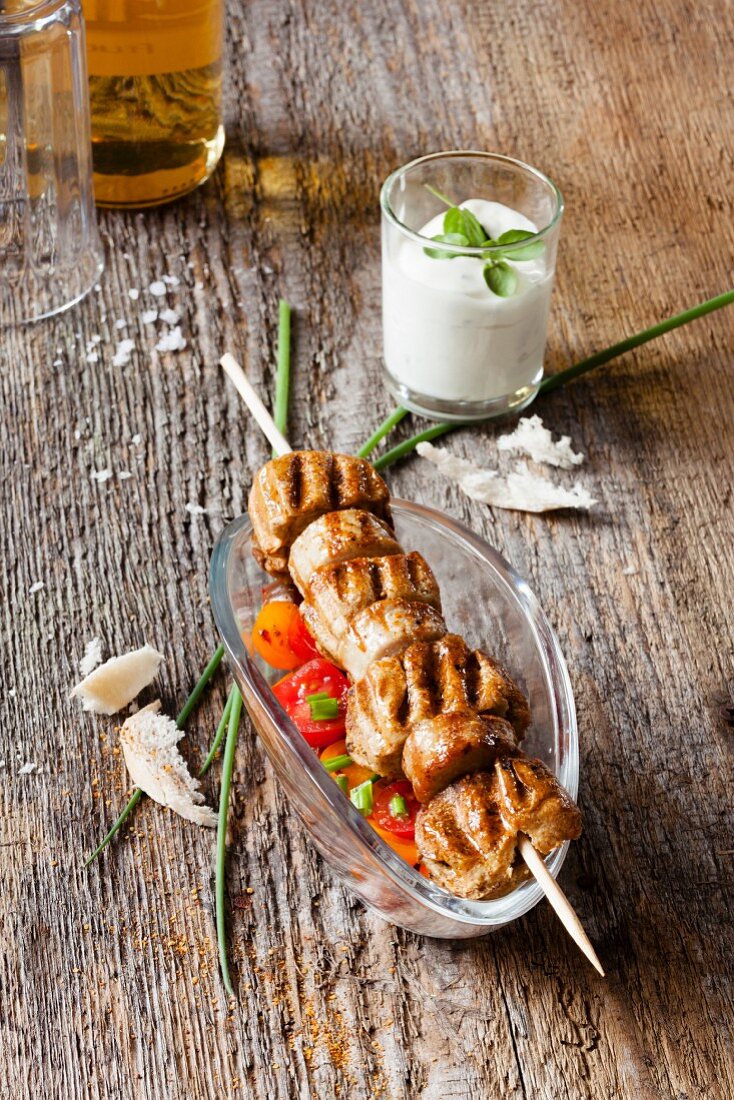 Sausage and bred kebab with a sour cream dip
