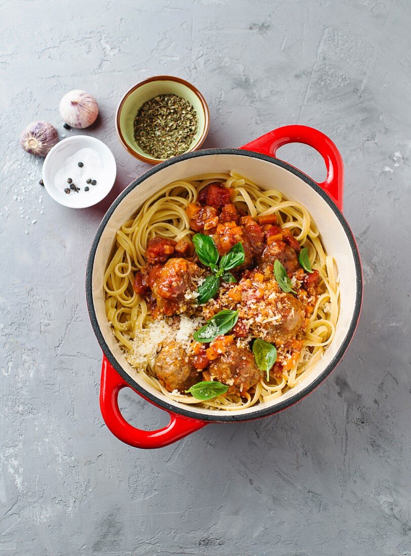 Pasta with meatballs in a pot (seen from above)