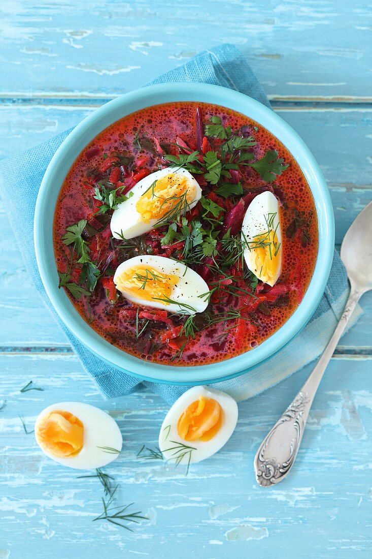 Beetroot soup with tender beetroot leaves, cream and hard-boiled eggs