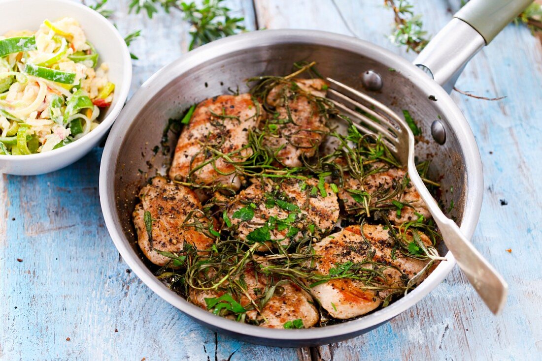 Grilled pork medallions with herbs