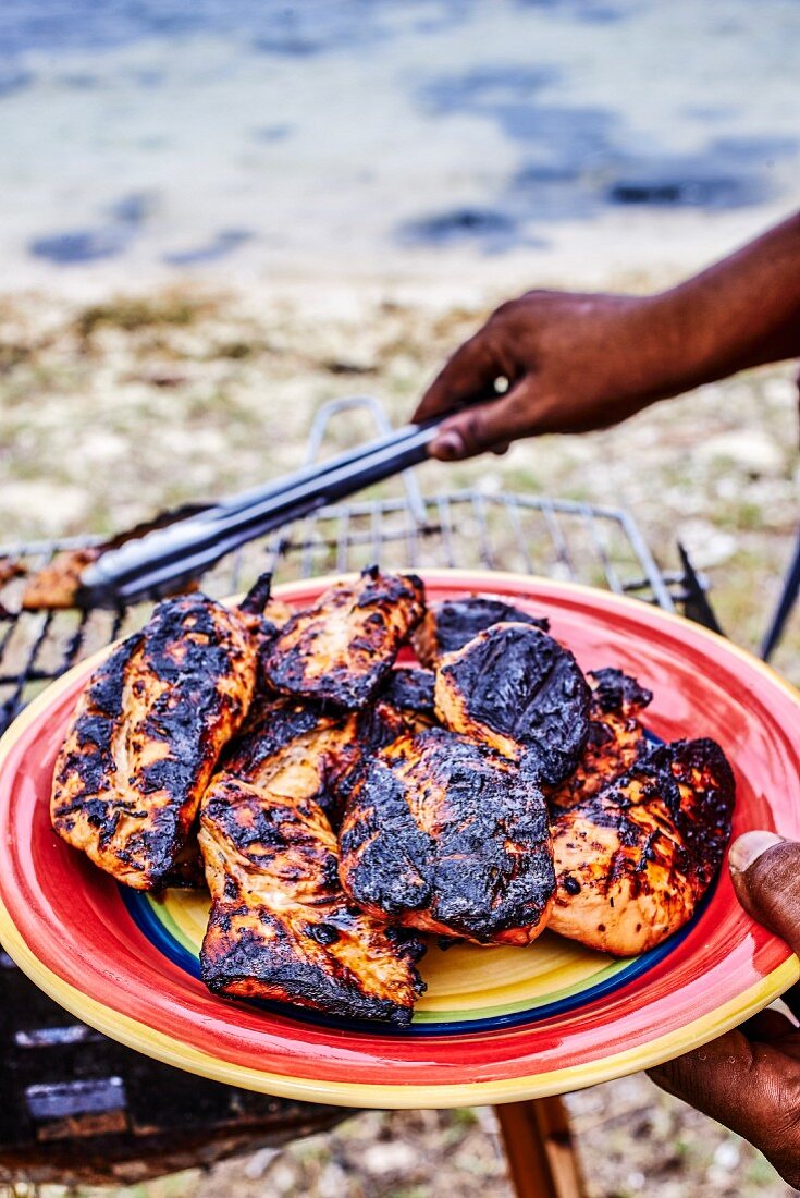 Barbecued chicken on a beach