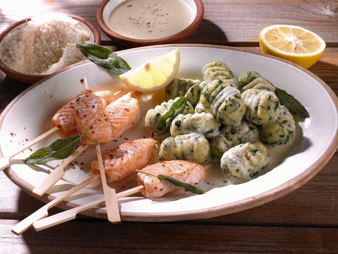 Salmon kebabs with spinach gnocchi, sage and Parmesan cheese