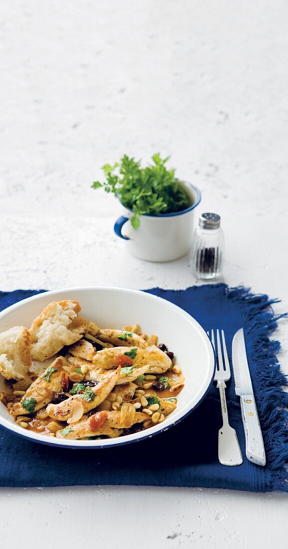Chicken with pine nuts and raisins