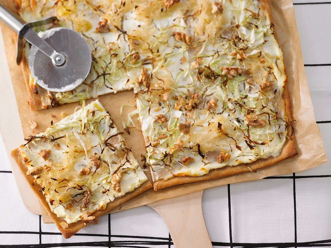 Tarte flambée with cabbage and walnuts