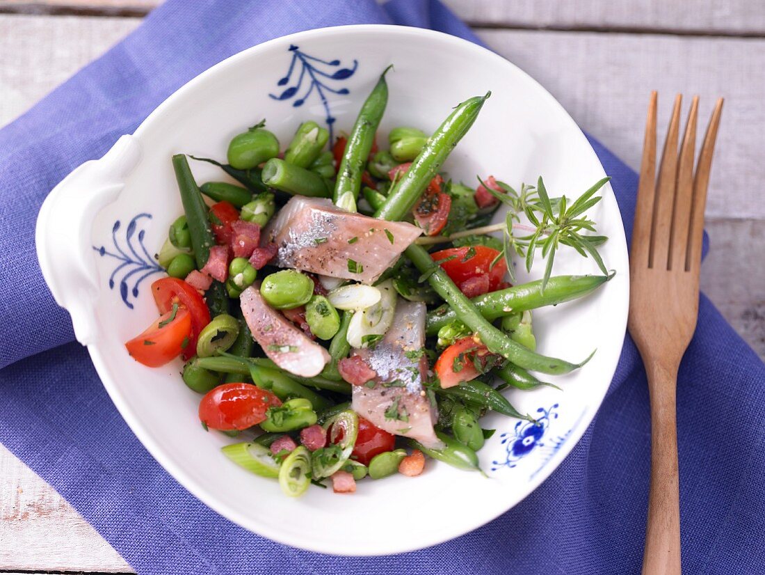 Soused herring & bean salad with cherry tomatoes and bacon
