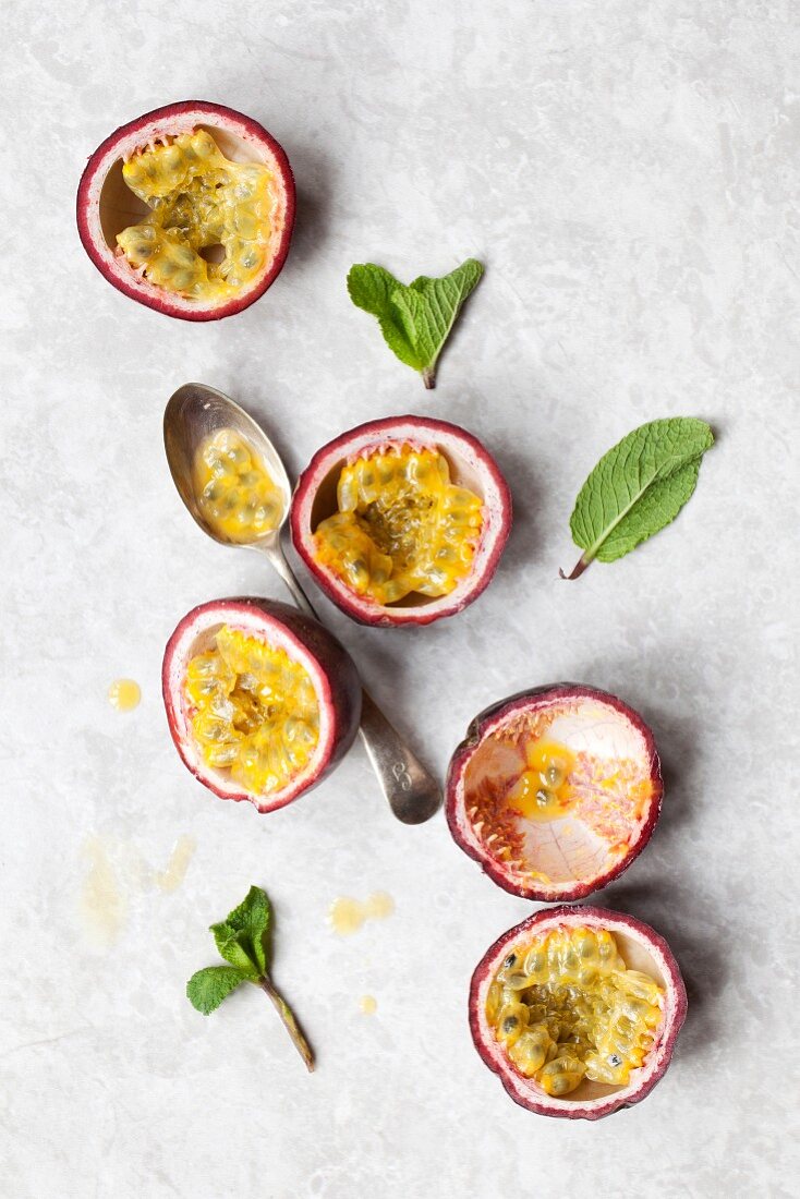 Passionfruit halves and mint leaves