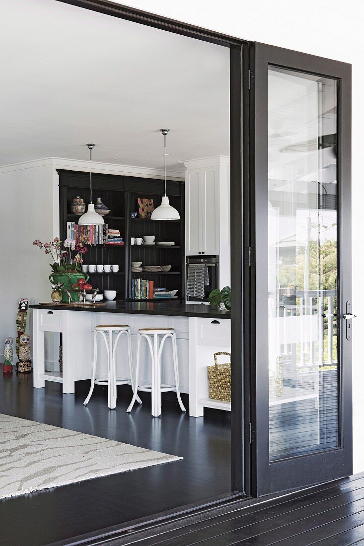 View from the terrace of the kitchen island with bar stools