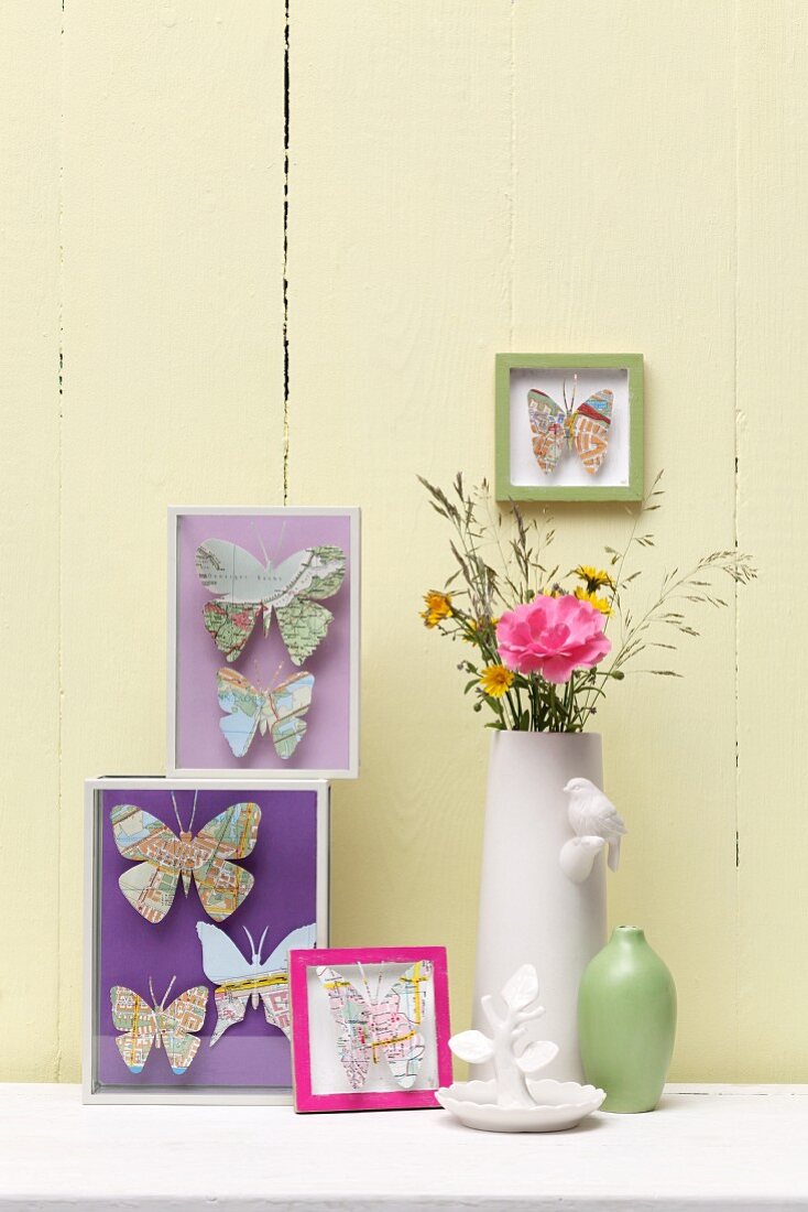 DIY display boxes with butterflies made from old maps