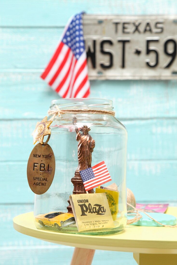 A DIY souvenir jar containing travel memories