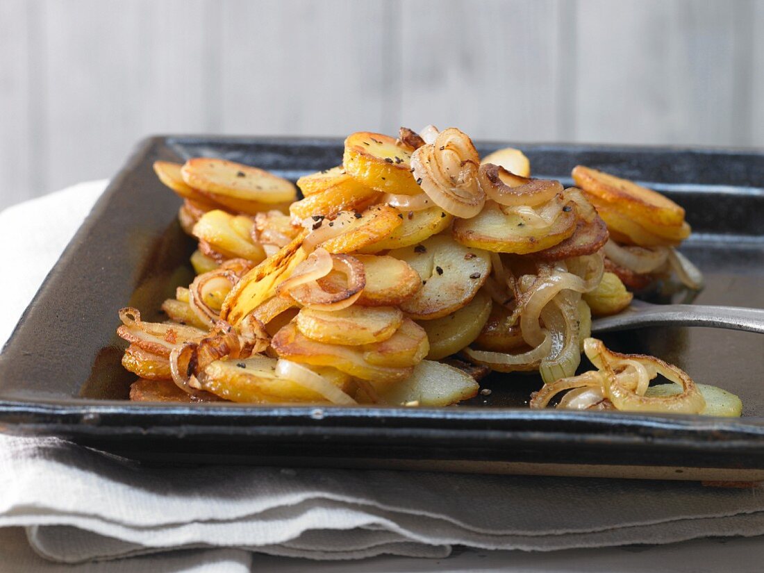 Home-made fried potatoes with onions