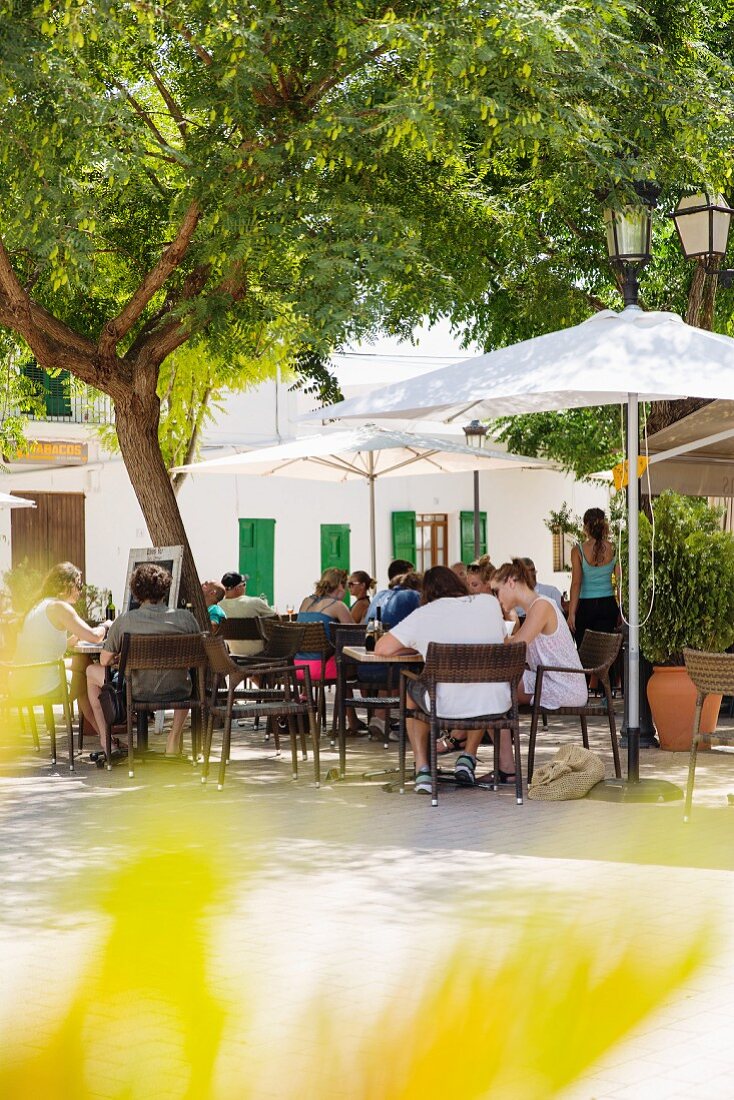 Guests at a street café in Santa Gertrudis on Ibiza, Spain