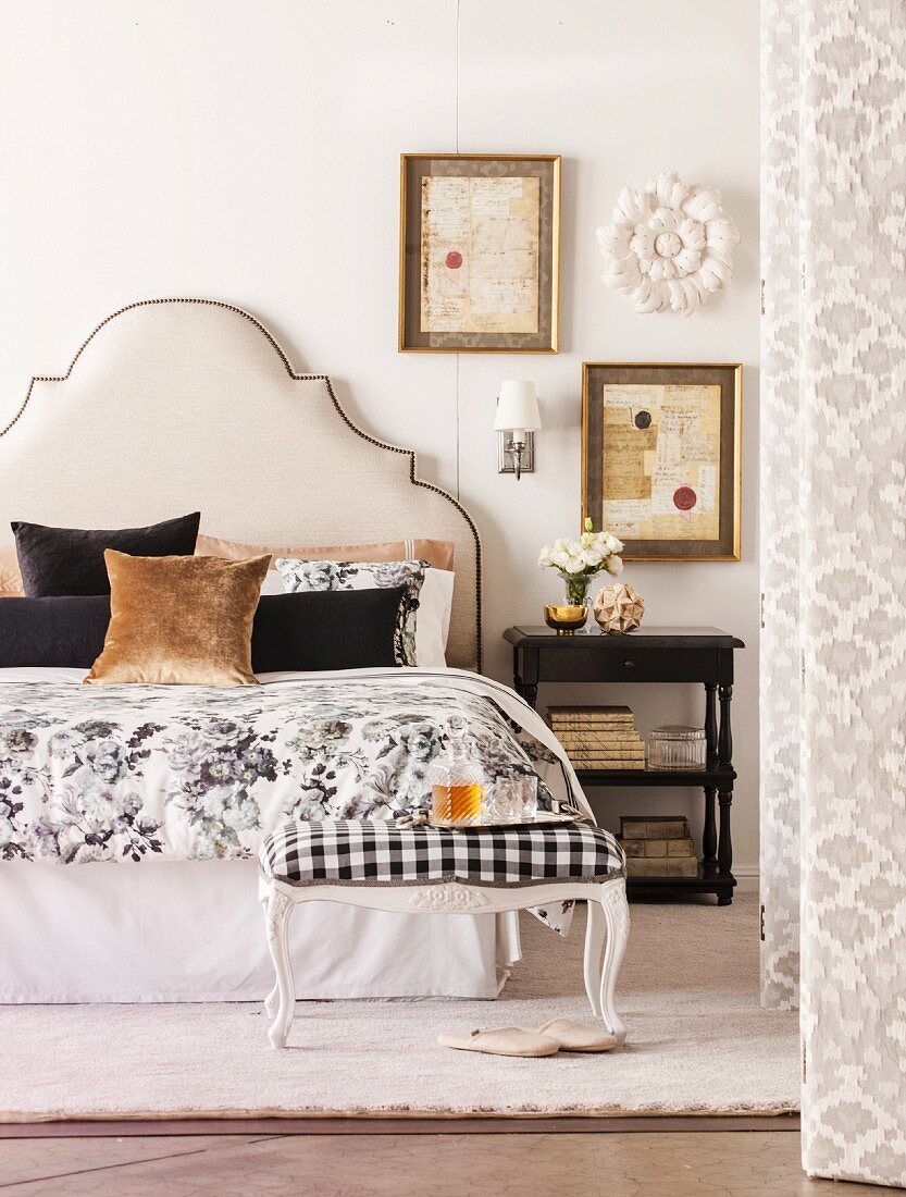 Bed with upholstered headboard in classic bedroom