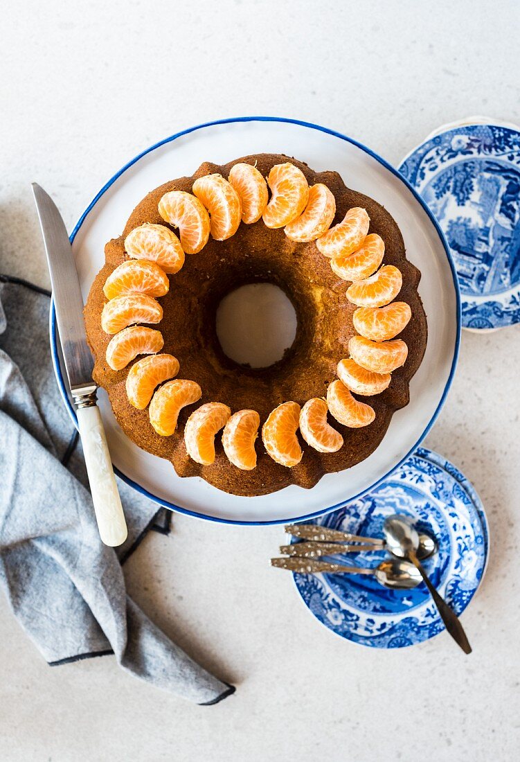 Olive oil Bundt cake with mandarin segments (seen from above)