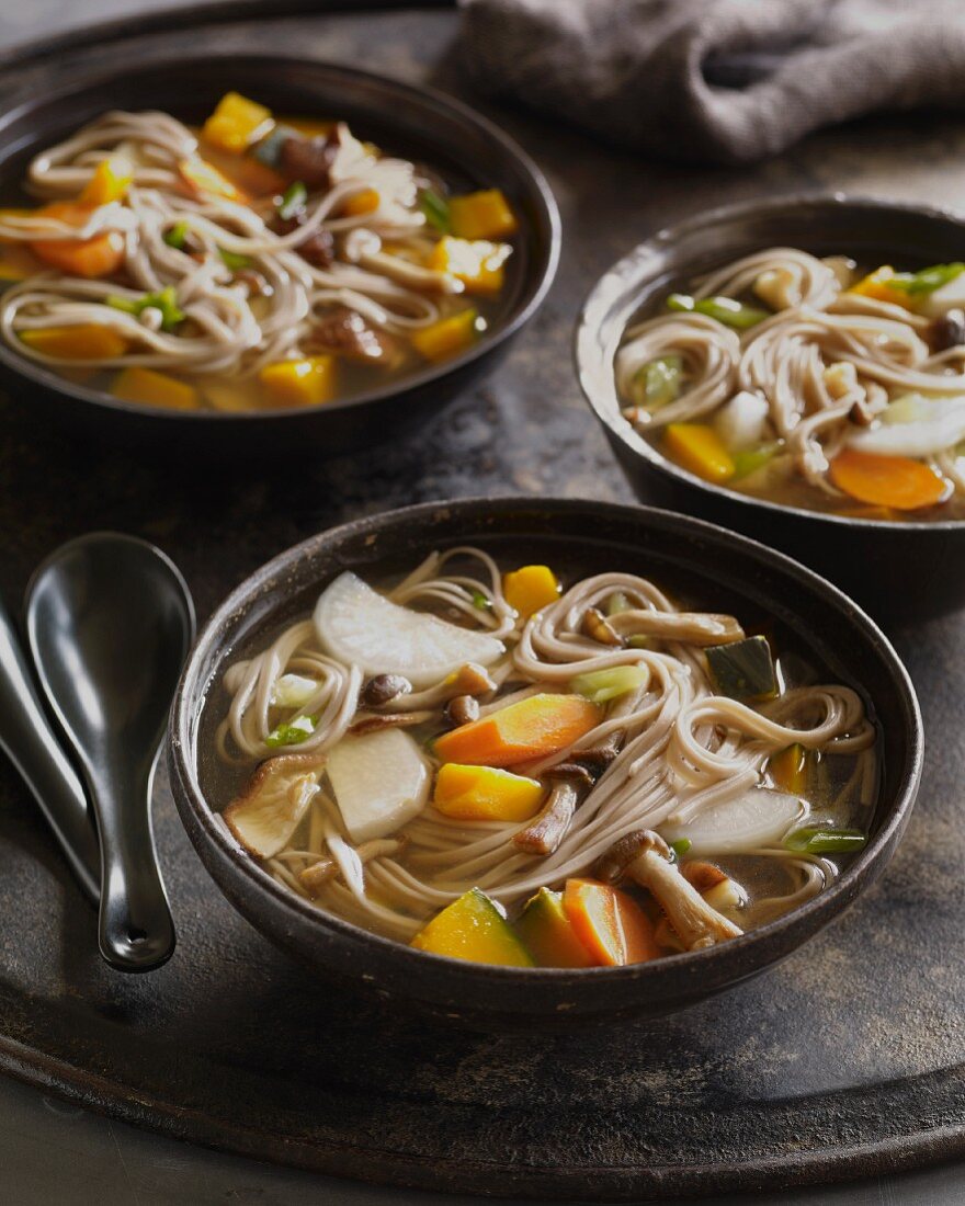 Soba buckwheat noodle soup with taro and carrots