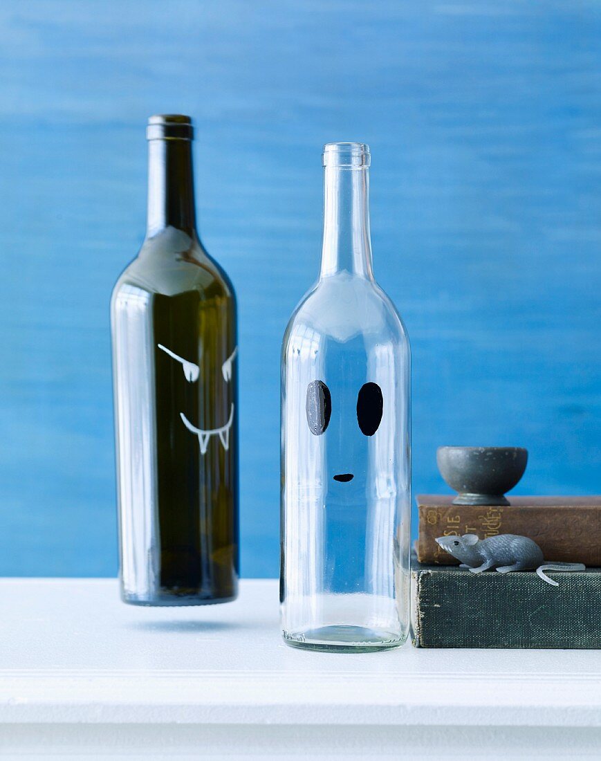Halloween bottles decorated with scary faces
