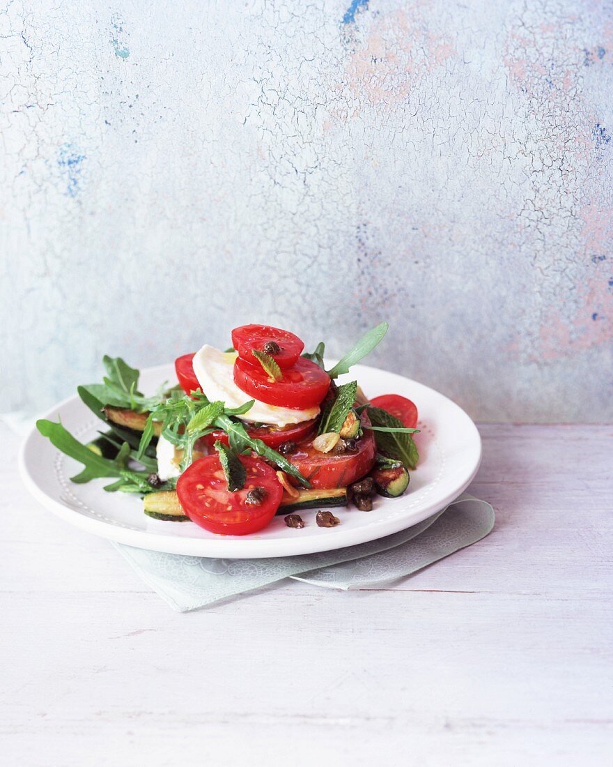 Tomato salad with courgette, mozzarella and rocket