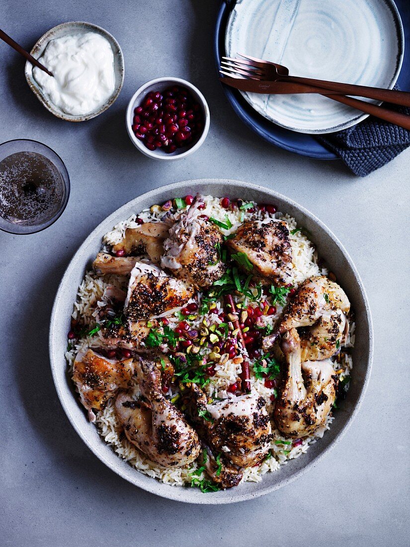 Za atar roast chicken with pilaf, pomegranate and nuts