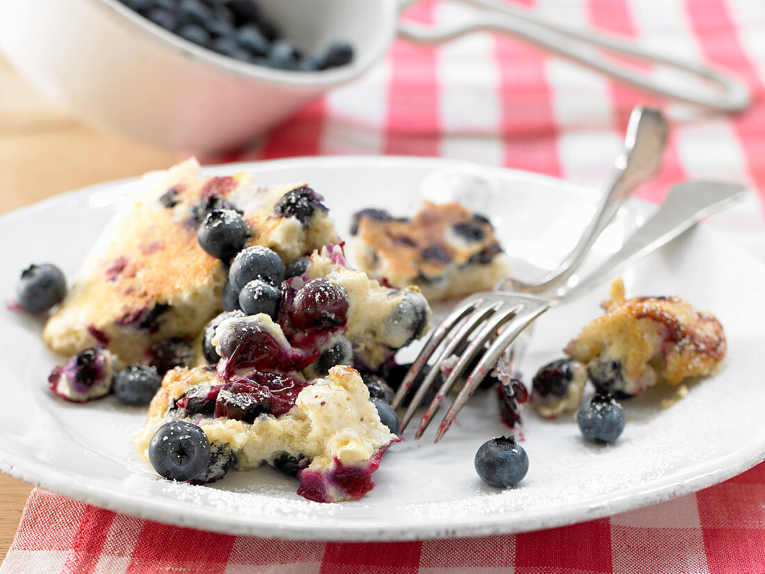 Kaiserschmarrn (shredded sugared pancake from Austria) with oats and fresh blueberries