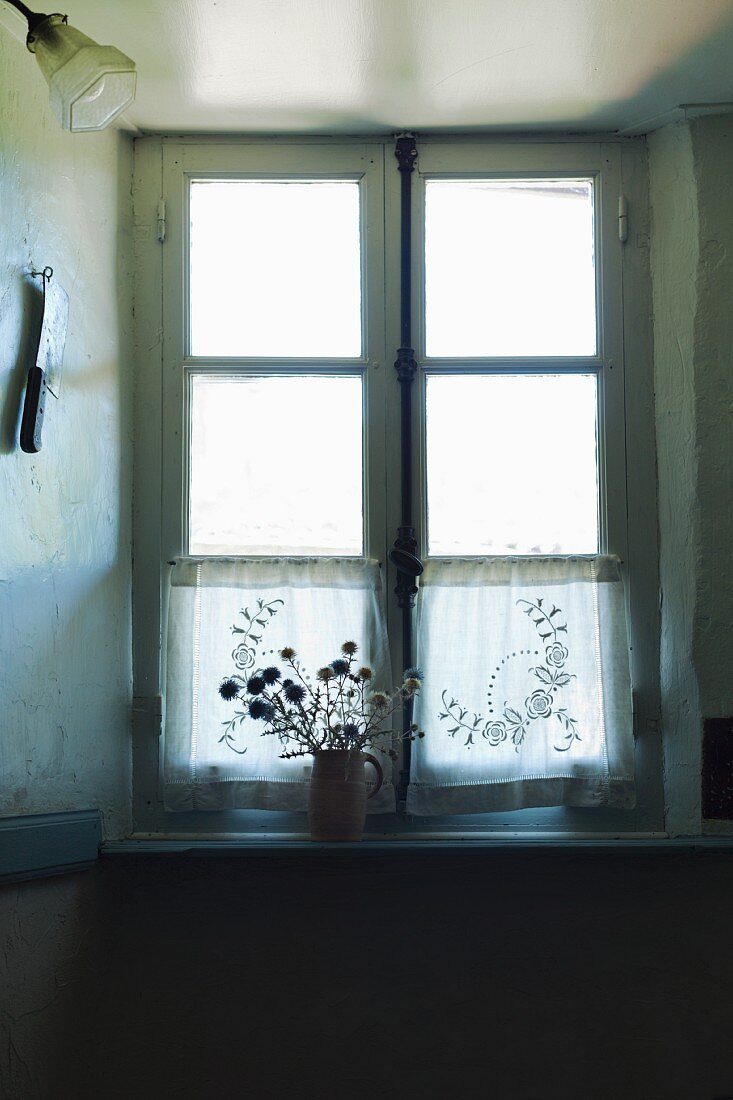 An old transom window, backlit