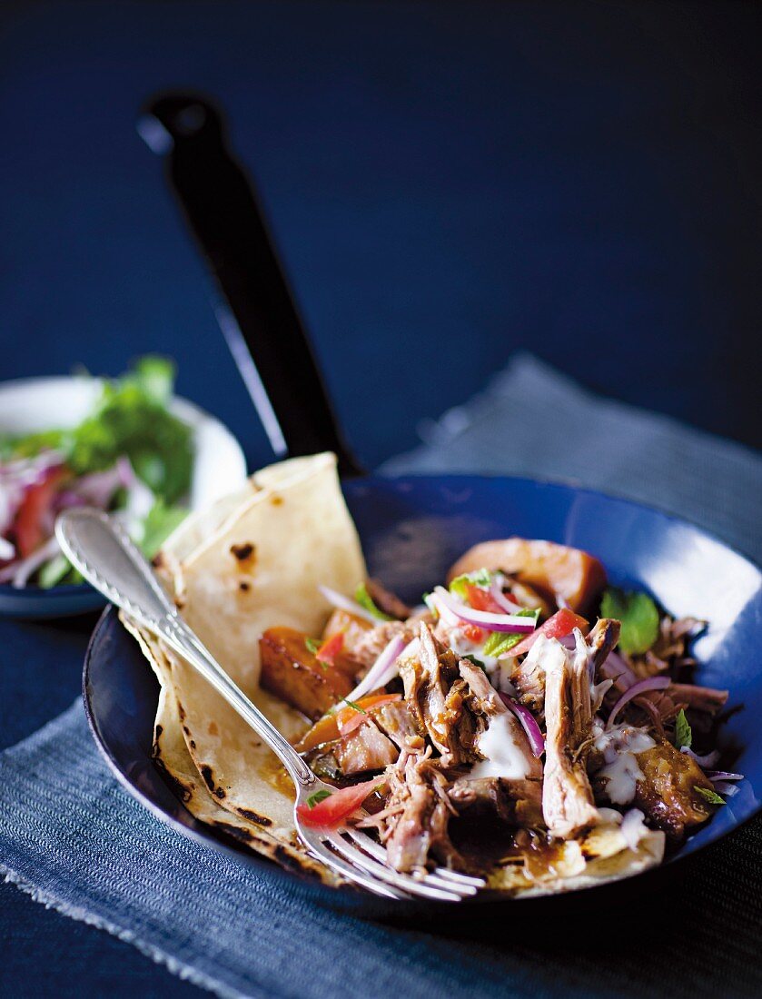 Slow-roasted duck with balsamic vinegar and lime on pancakes