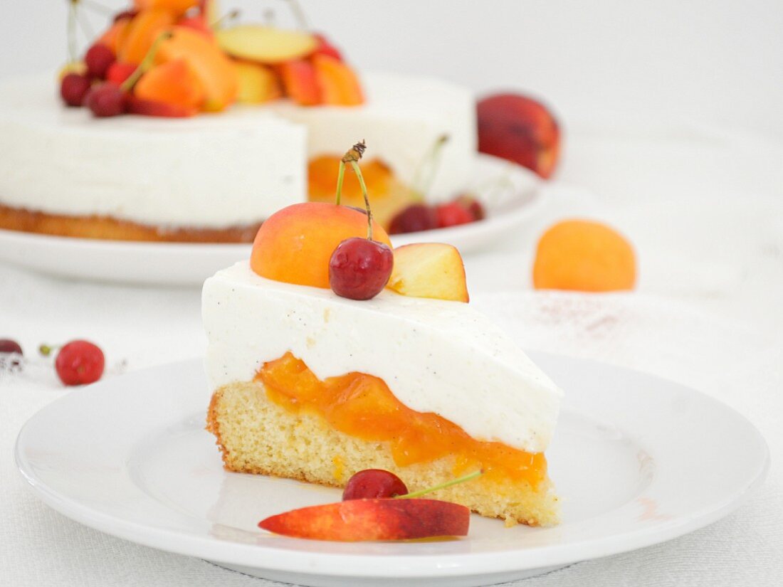 A sliced yoghurt cake with apricots and cherries